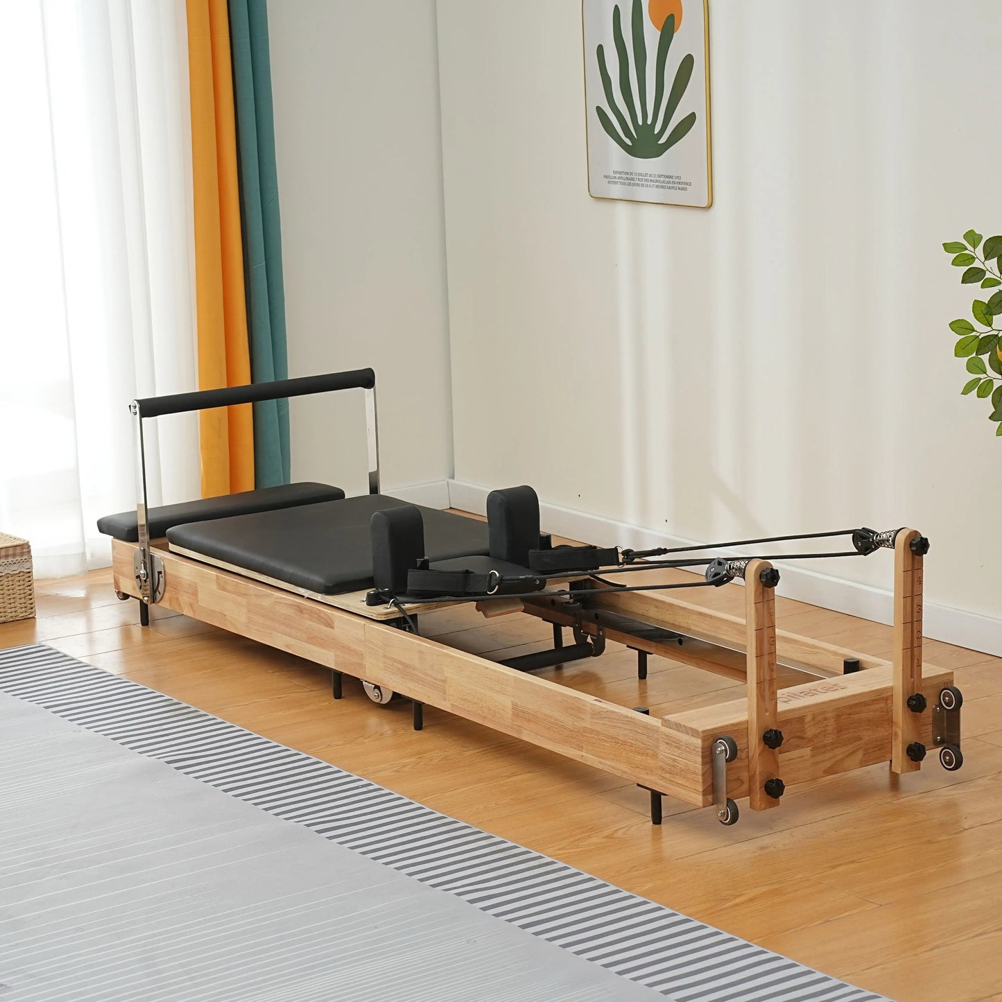 Oak Pilates reformer with space-saving design, perfect for home workout spaces.